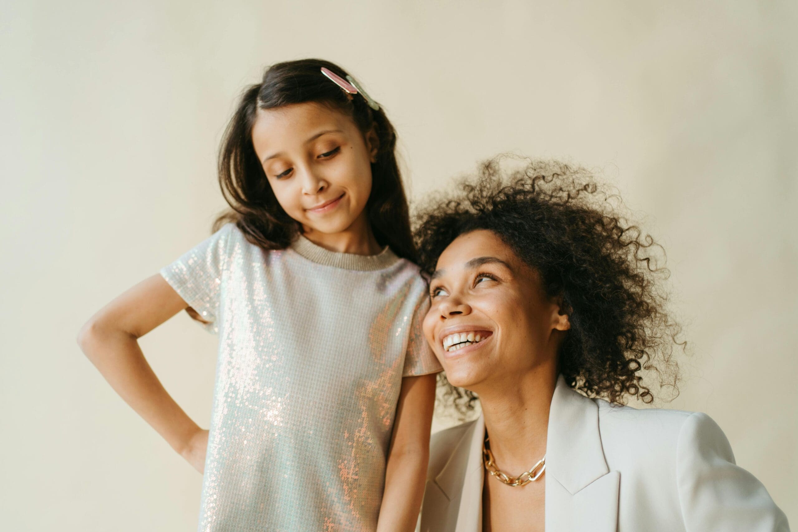 Mum smiles with happy daughter